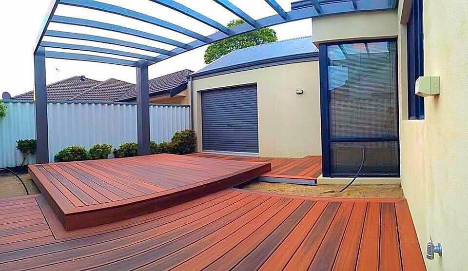 Charming Wood Decking with Outdoor Furniture and Planters